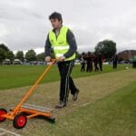 Groundstaff try to ready the pitch for play 3/7/2012