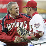 220px-George_W._Bush_after_throwing_out_1st_pitch_at_Nationals_home_opener_2005-04-14_1