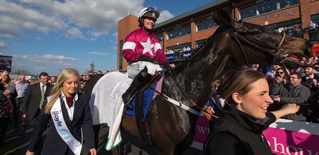 Katie Walsh celebrates onboard Thunder And Roses in the parade ring after winning 6/4/2015